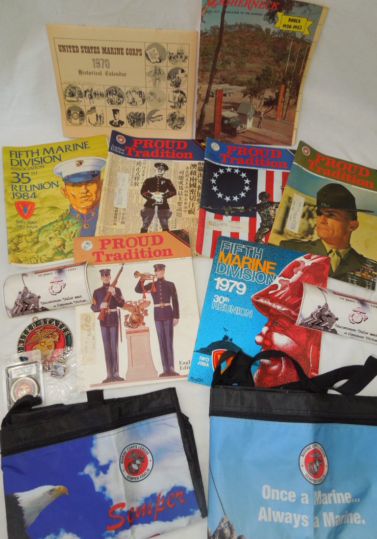 Lot of USMC Leatherneck Magazines & Ephemera: Lot of various USMC magazines, bags, challenge Coin, honor flight pin, 1970 Marine Corps Historical Calendar, and more.