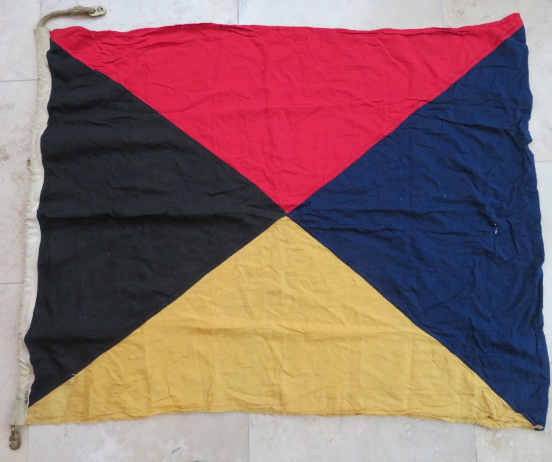 Maritime Nautical Flag Zulu "Z" Require A Tug: Maritime Nautical Flag Zulu "Z" Require A Tug. Vintage Cotton Navy Maritime Ship's Signal Flag. Design is sewn with rope and brass hardware. This flag is used and has the look of having been out in th