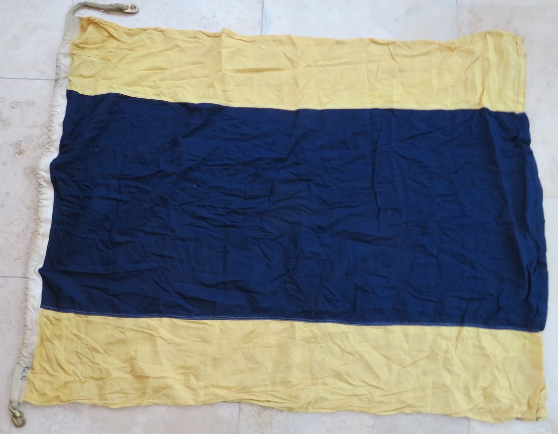 Maritime Nautical Flag Delta "D" Keep Clear: Maritime Nautical Flag Delta "D" Keep Clear. Vintage Cotton Navy Maritime Ship's Signal Flag. Design is sewn with rope and brass hardware. This flag is used and has the look of having been out in the 