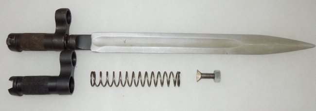 Russian Russia SKS Rifle Spike Bayonet & Parts: SKS Spike bayonet for the Russia Russian SKS rifle. This lot includes the spike, screw, spring, and collar. Spike Bayonet (blasted blade) and extra parts as shown. The spike measures 12 1/4 inches.