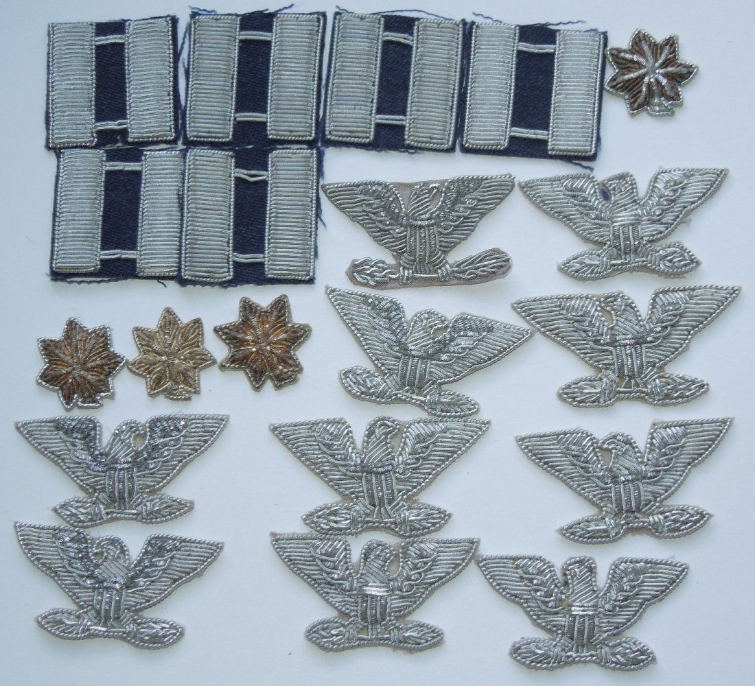 1950s US Air Force Officer Bullion Rank Insignia Lot: Lot of Captain, Major, Lt. Colonel, and Colonel rank insignia as worn on 1950's and 1960's era USAF blue uniforms by officers. Most of these are unused, and probably theater made in Southeast Asia.
