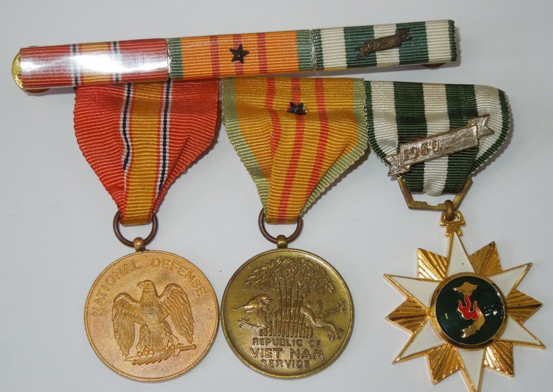 Vietnamese Made US Military Service Medal Bar & Ribbons: Lot of three in country theater made medals- Vietnam Service, National Defense Service, and RVN Service Medal, and associated three place plastic covered ribbon bar.