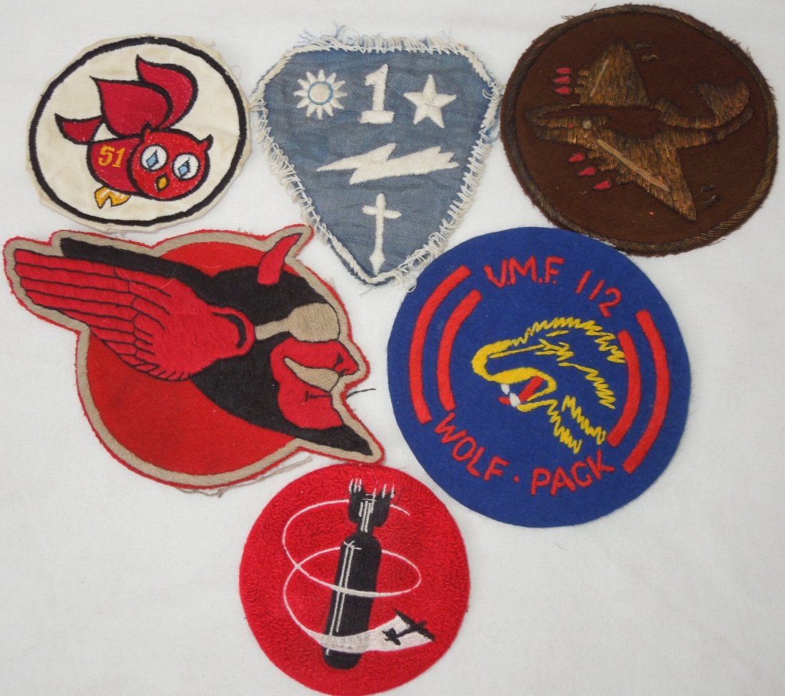Lot of 6 Repro WWII Squadron Patches: Lot of high quality reproduction patches, Navy and Army Air Force WWII pieces to include VB-5, VMF-112, 769th Bomb Squadron, CBI Air Commando, and 75th Fighter Squadron. One is bullion.