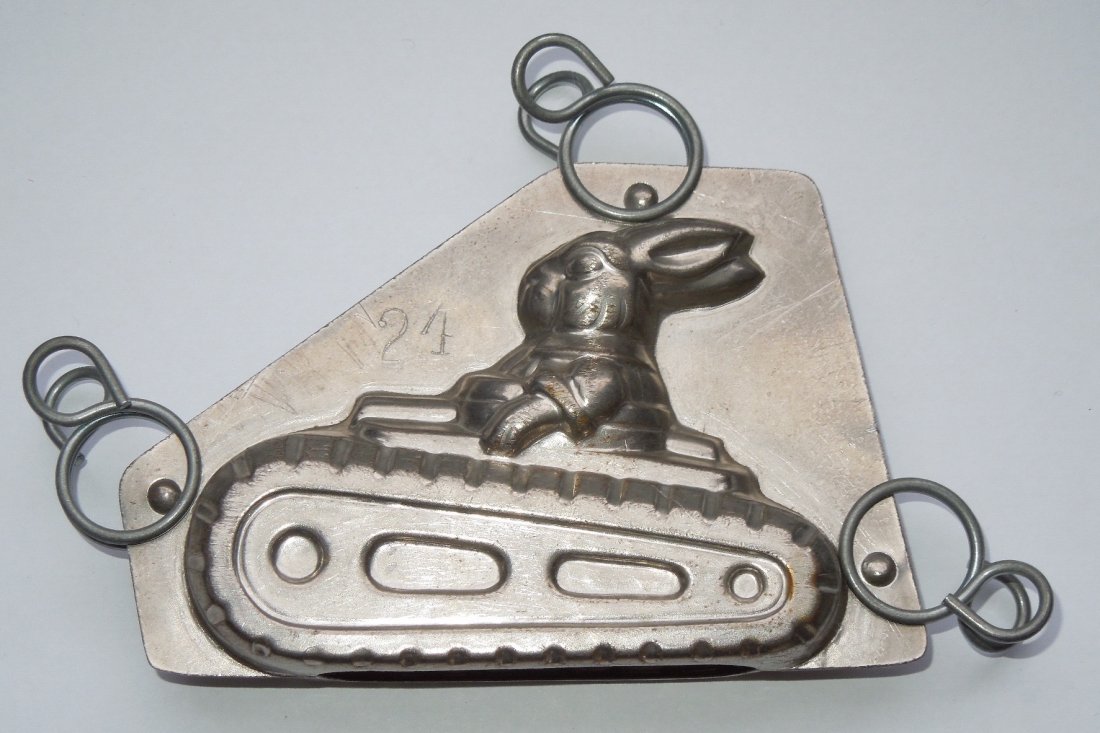 Pre WWII German Rabbit in Military Tank Chocolate Mold: Original WWI - 1930s era German tin style chocolate mold depicting a rabbit riding in an armored tank. The numbers 24 and 52 are stamped onto it.