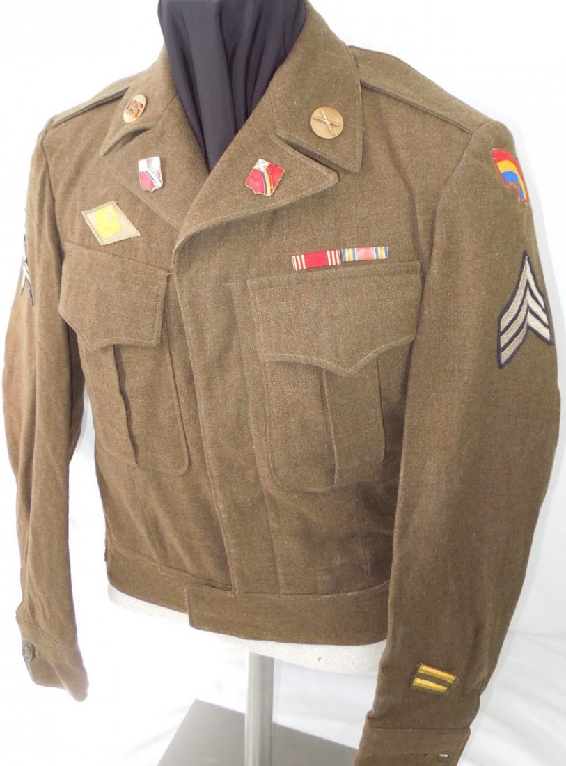 WWII 42nd Inf Div US Army 264th Artillery Ike Jacket: US Army WWII Ike jacket with a 42nd Infantry Division patch chain stitched with red thread signifying Artillery, along with Artillery Collar brass, ribbons, and screw back 264th Coast Artillery DUIs o