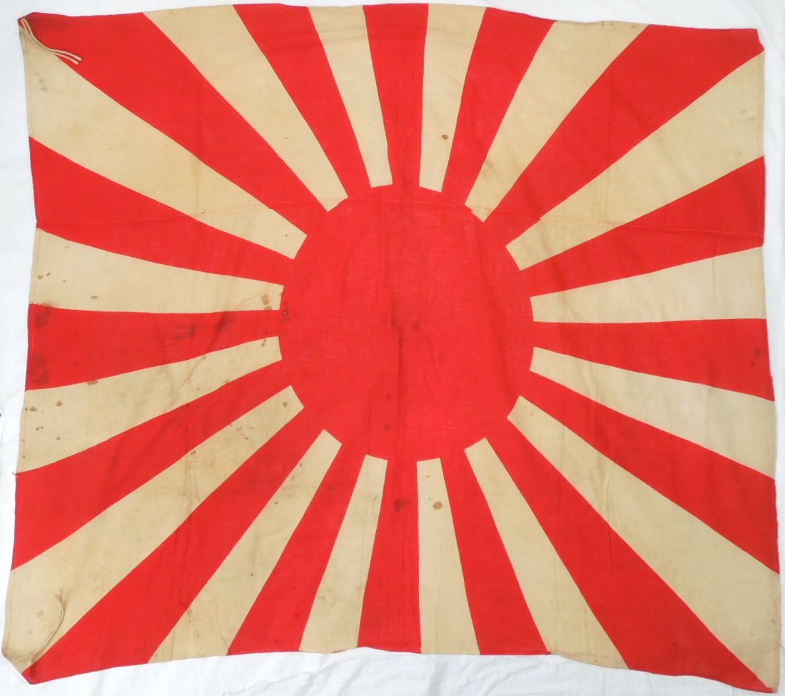 WWII Japanese Army Rising Sun Flag Captured at Okinawa: Original WWII cloth double sided Japanese Rising Sun Imperial Army flag measuring approximately 48 inches by 40 inches in size. Consignor noted that he bought it from a USMC veteran who claimed to hav