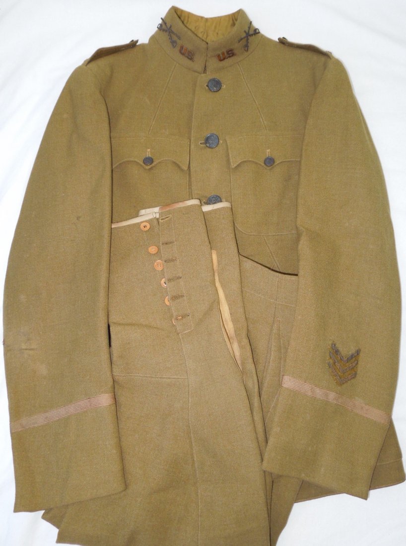 WWI US Army 1st Cavalry Officer Uniform and Breeches: WWI US Cavalry 1st Lieutenant jacket and breeches with bronzed pin back crossed swords, three bullion overseas service chevrons. Good condition with some minor mothing and wear consistent with age. (I