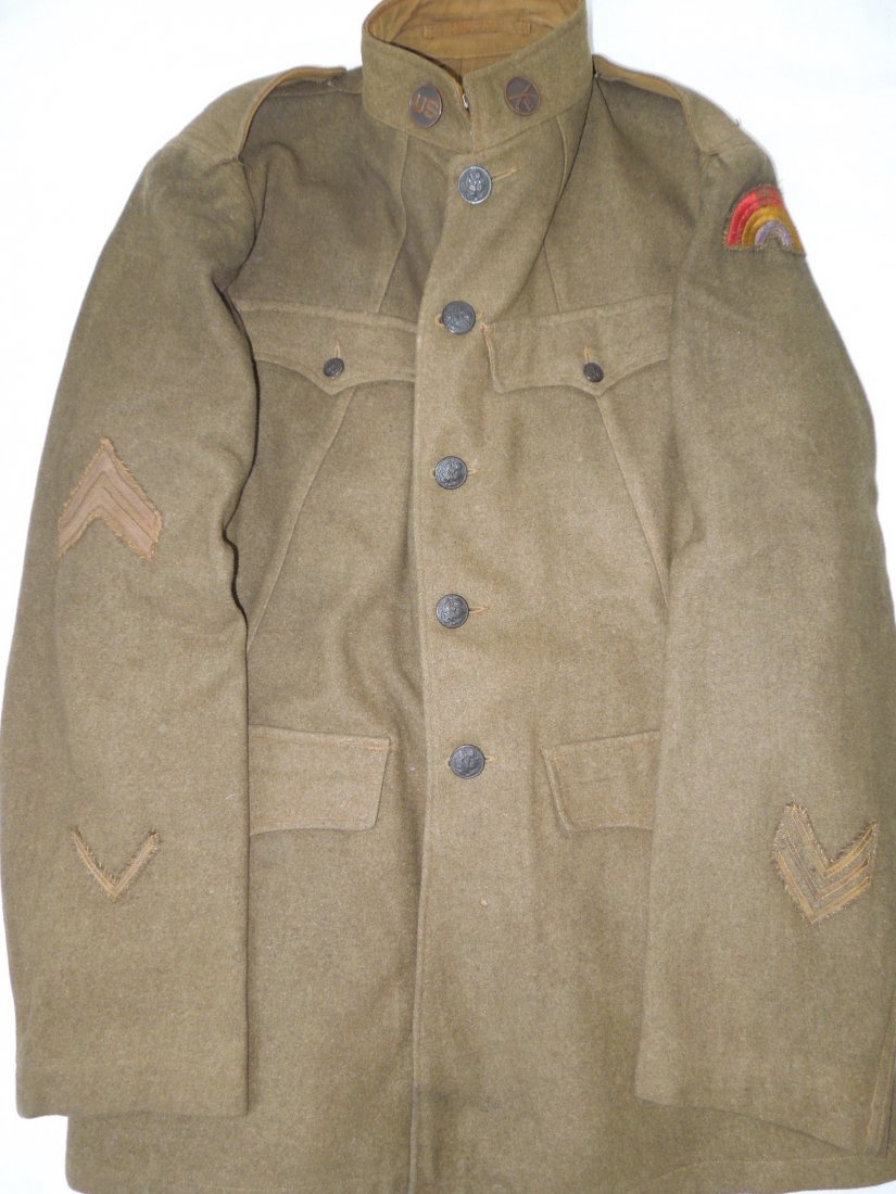 WWI US 42nd Infantry Custom Made Wounded Uniform: WWI 42nd Infantry Division uniform jacket with a unique front top pocket design, custom full rainbow 42nd patch, one wound chevron, and three overseas stripes. Some mothing from age. Not named and no 