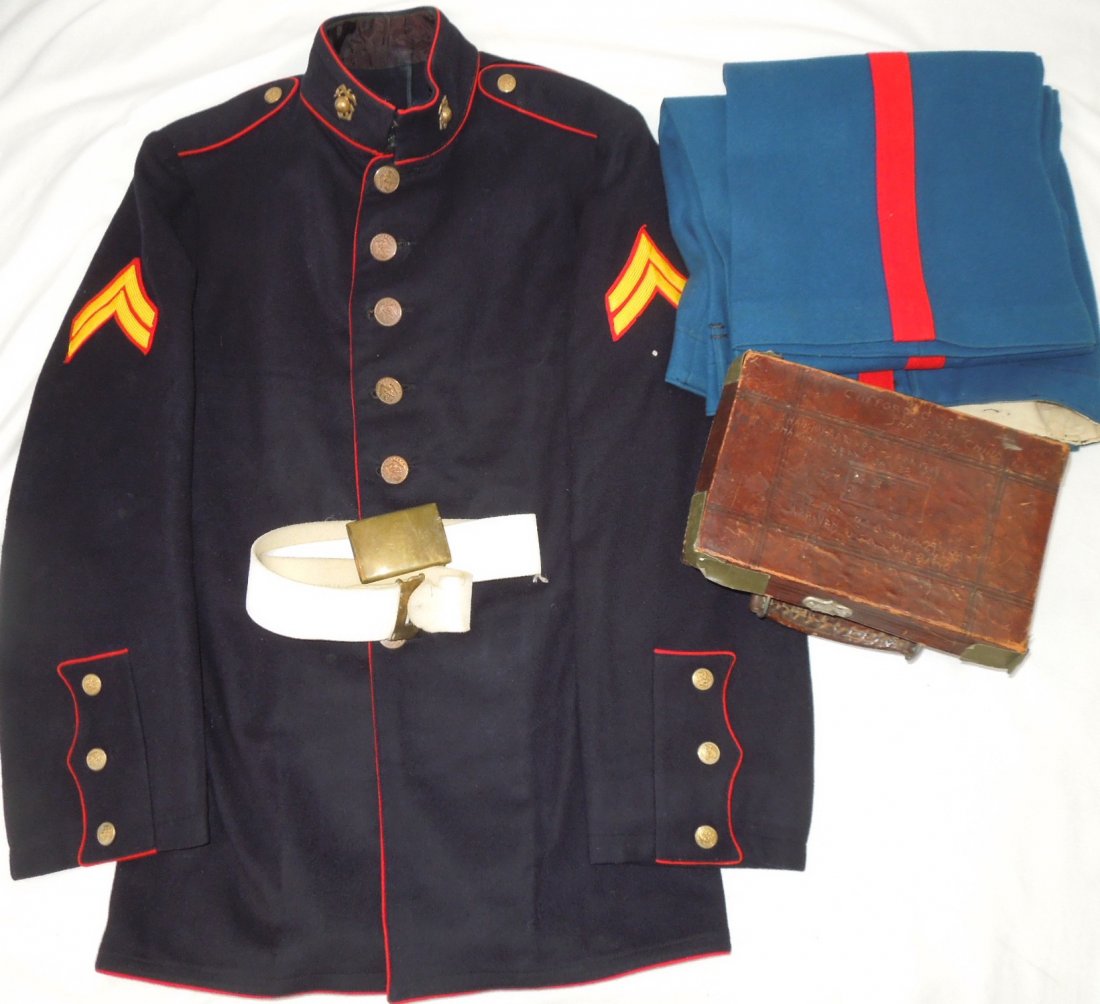 1930s China Marine Dress Blue USMC Uniform and Box: 1930s era Shanghai, China US Marine Dress Blue uniform group to CC Wells consisting of his jacket, pants, belt, and a hand etched leather type box detailing his service experience there. A very unique