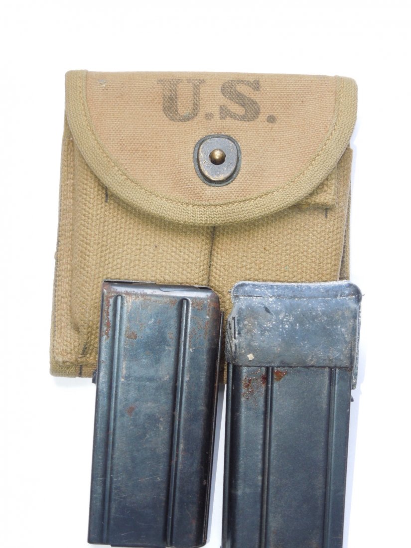 WWII M-1 Carbine Magazines and Pouch 1942: Note: This lot can only be shipped to a United States Mailing Address. 1942 dated M-1 Carbine pouch and two magazines (one marked SYB and one G-Q).