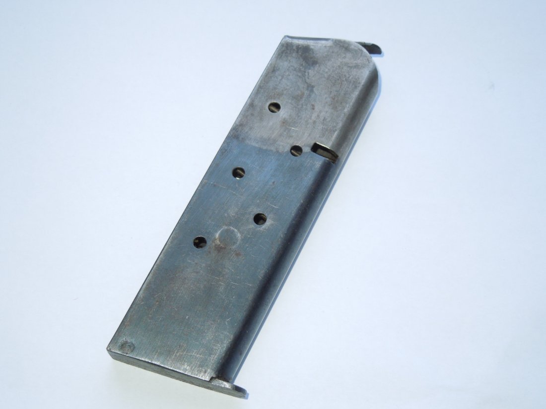WWI US Military Two Tone Colt .45 Pistol Magazine: Note: This lot can only be shipped to a United States Mailing Address. Original WWI era two-tone Colt .45 pistol magazine.