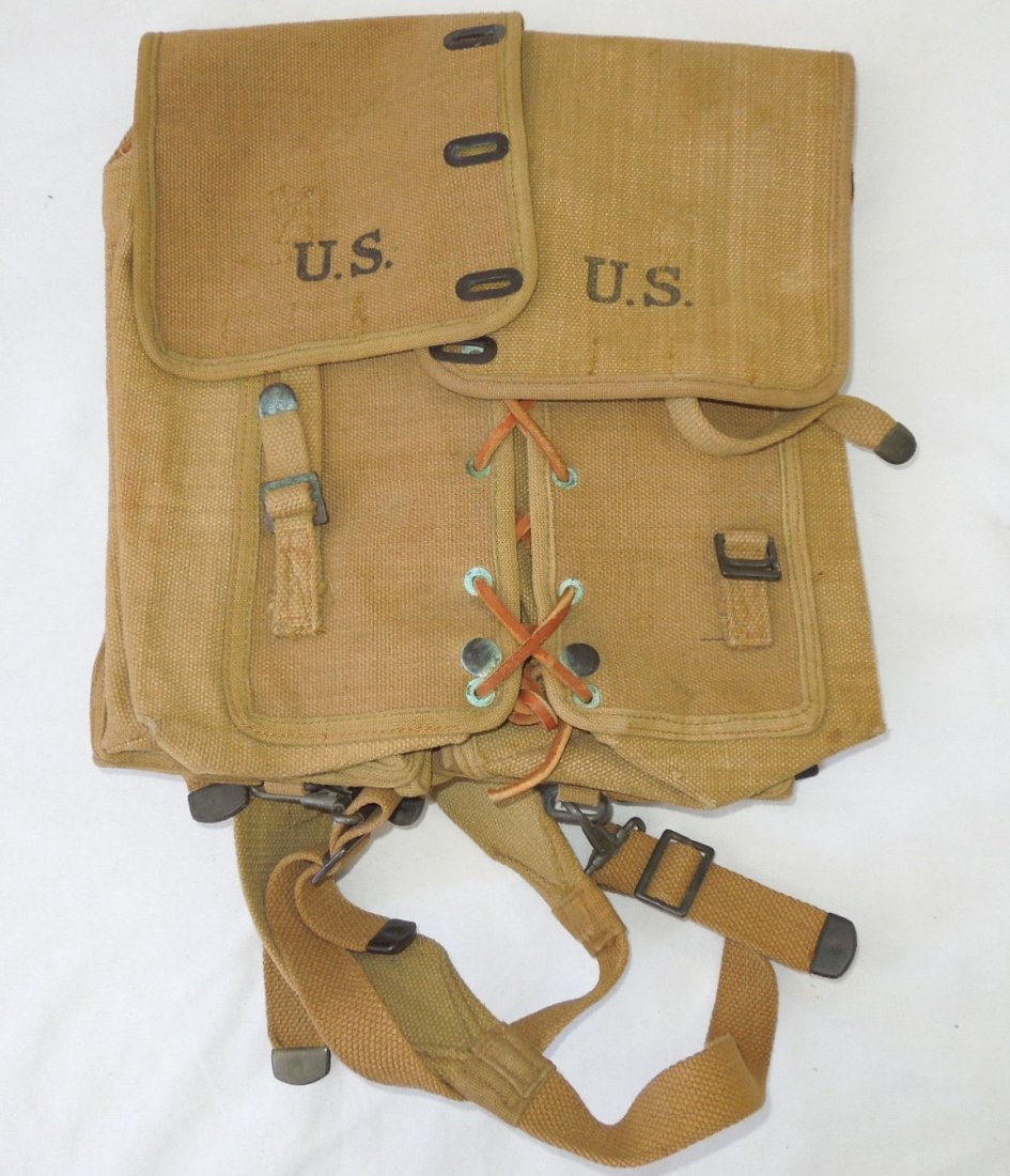 WWII 1917 US Military Saddle Pack: WWII US Military Canvas Saddle Pack. P.B. & CO. 1917 and 1918. Leather ties. Green oxidation around the metal pieces. Otherwise, in good condition. (III A 15)