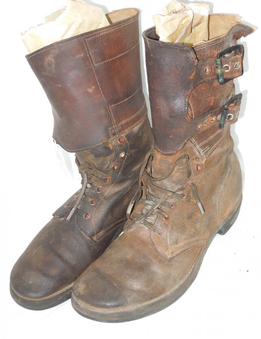 WWII US Army Combat Double Buckle Boots: US Army Combat Boots with 2 buckles attached. Brown leather boots Marked on bottom of boots Beebe Bros. Used condition. The left boot is missing part of the leather at the top. The right boot on one o