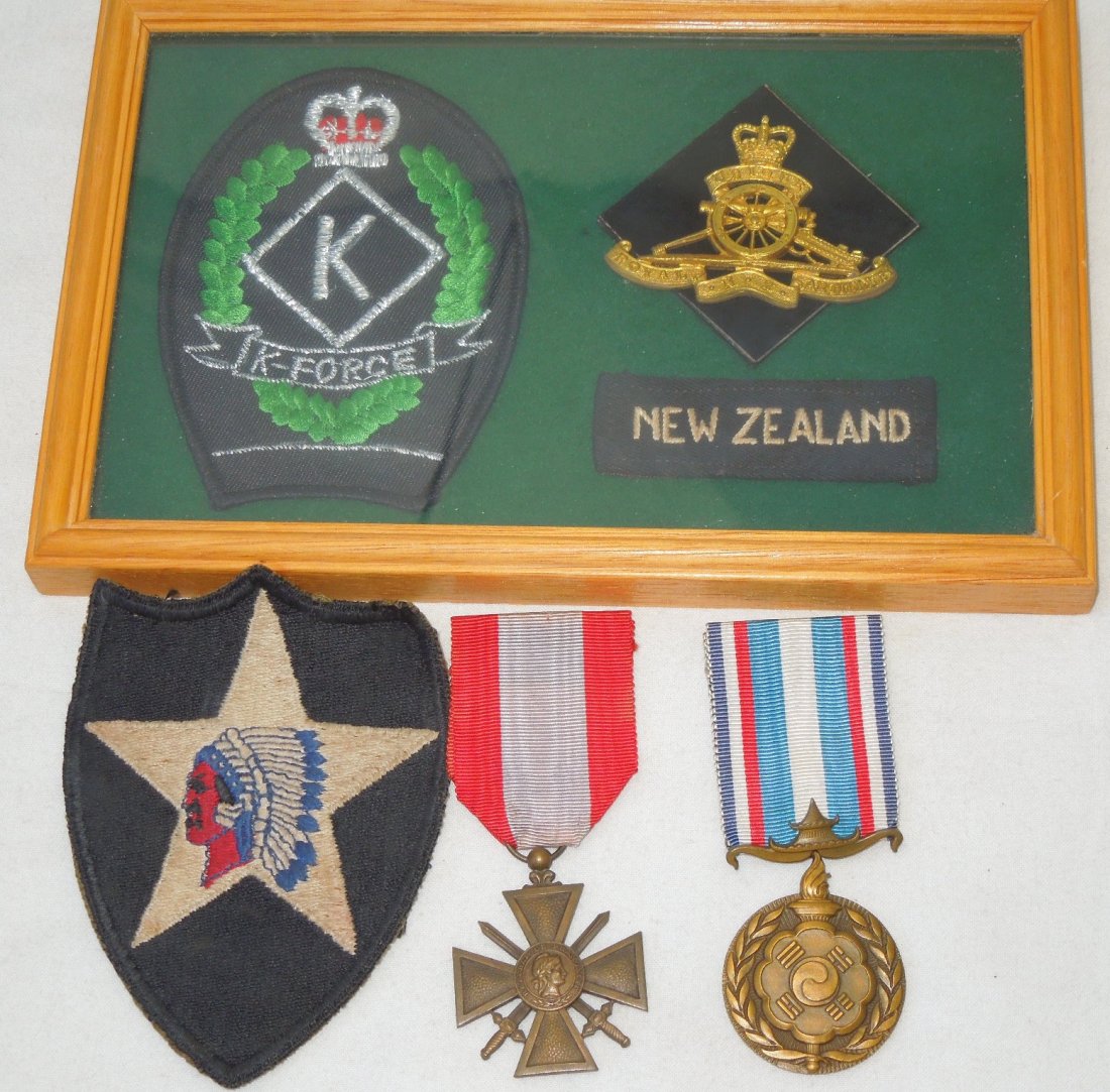 Korean War New Zealand K Force French 2nd Division: Set of two French medals and a 2nd Infantry Division patch from a Korean War Display, as well as a New Zealand K-Force framed display with information printed on the back.