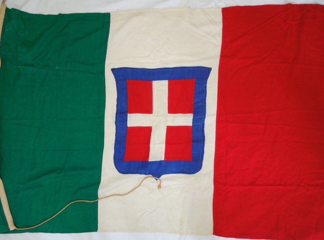 WWII Kingdom of Italy Large Naval Ensign Flag Italian: WWII very vibrant colored Italian House of Savoy national flag measuring approximately 54 inches by 36 inches in size. Possible a Naval Ensign given the attachment cord. Consignor noted that it is a U