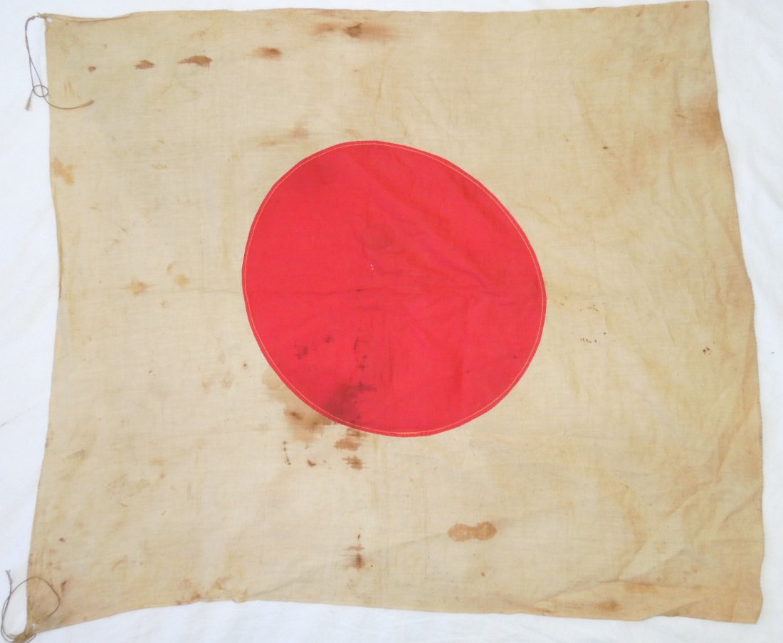 WWII Iwo Jima Bringback Japanese Flag: Original cloth WWII Japanese military flag measuring approximately 30.5 x 26.5 inches. Consignor included a card noting that he obtained it from an unnamed USMC vet who picked this up in very soiled c