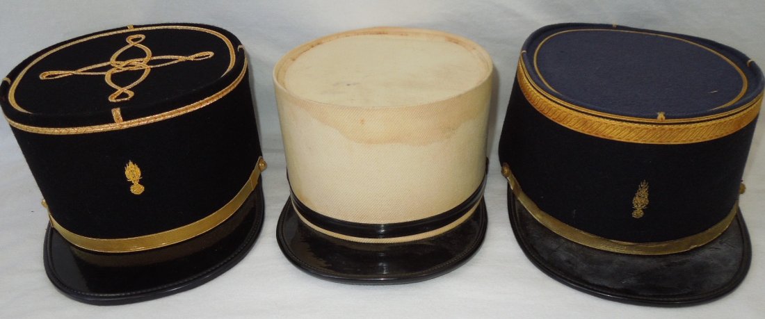 Three 1950s French Military Kepi Hats: Lot of three 20th Century French Army / Foreign Legion Kepi style hats, with ornate bullion insignia.