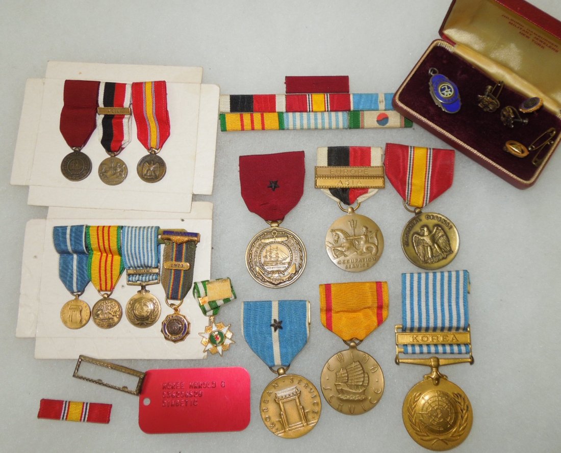 Korea - Vietnam US Navy Medal Dog Tag Group: US Navy Korean War to Vietnam War group to Harold McCree with his full and mini sized medals, misc. insignia, red dog tag, cuff links, and a nice 7th AAF medallion. Fair to good condition on these ite