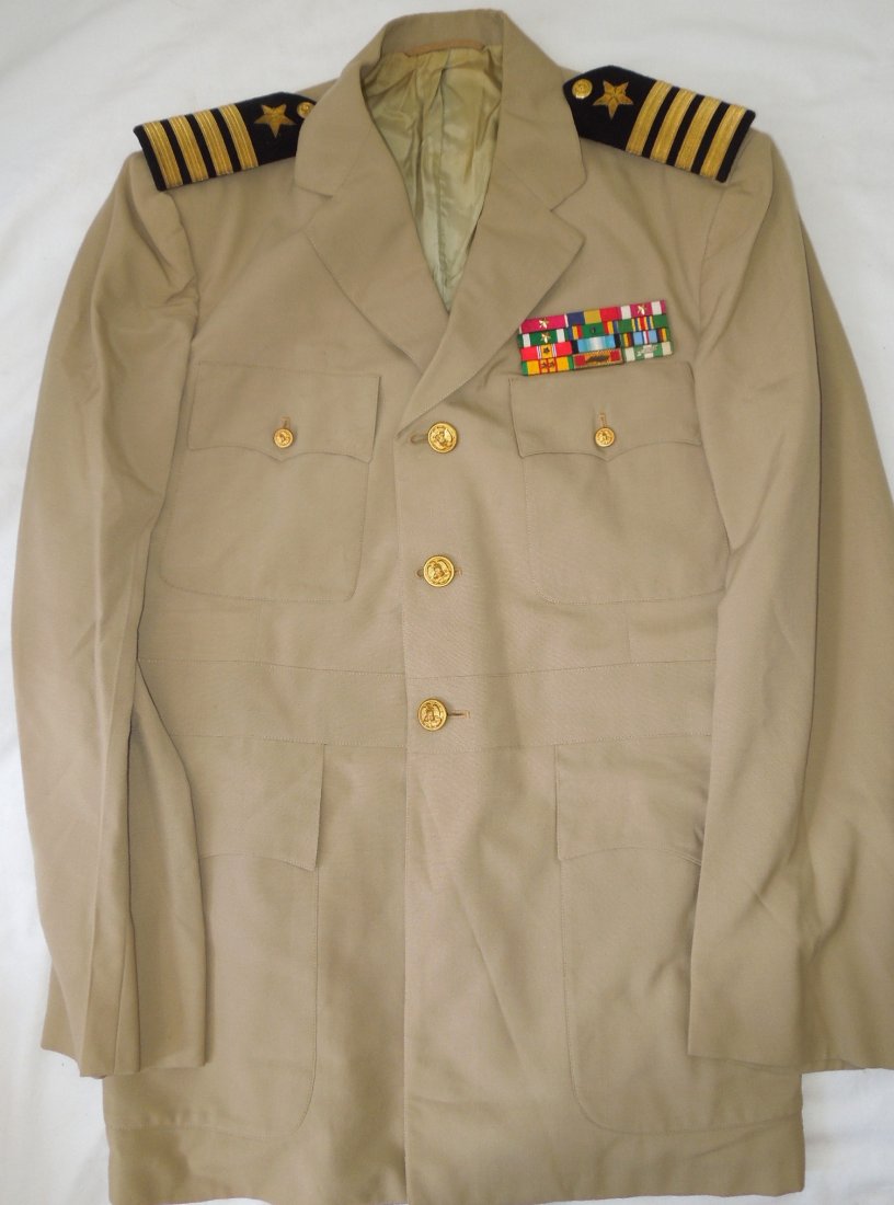 US Navy Captain Named Antarctic Service Uniform: USN Khaki uniform from the 1960s named to Dr. J.V. Sharp on the tailor tag. Features Vietnam and Antarctic service and a Legion of Merit and Navy and Marine Corps Medal, among others. One cloth strap 