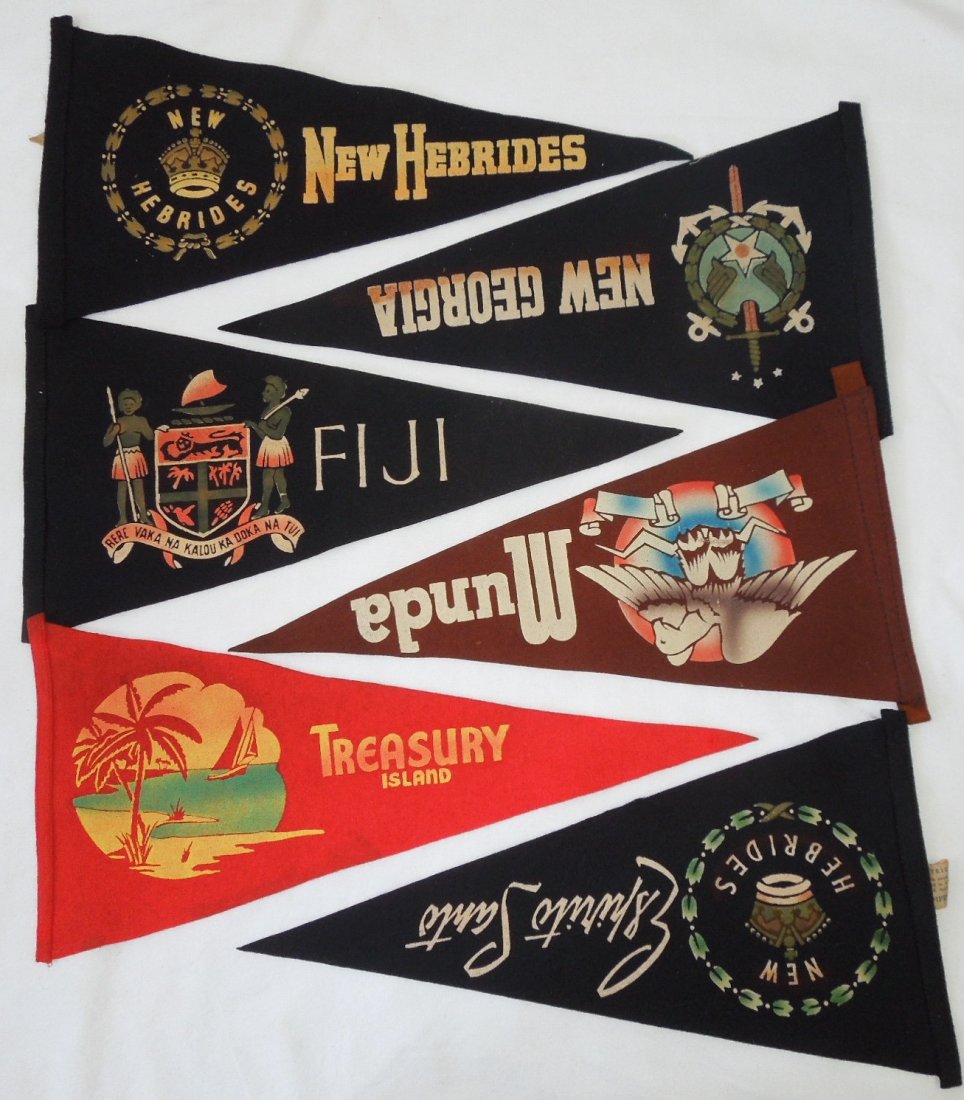 WWII Made in New Zealand Souvenir Pennants: Lot of six pennants from the South Pacific with some bearing tags made in Auckland, New Zealand. These were popular bring backs of USMC veterans stationed or visiting those areas. Good condition for i