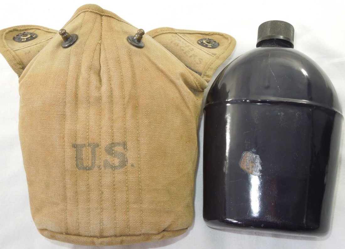 WWII Named US Military Black Enamel Canteen & Pouch: WWII 1942 dated black enamel canteen (good condition) in a canteen cup and B-G Inc 1942 marked canteen cover named to James Rogers.