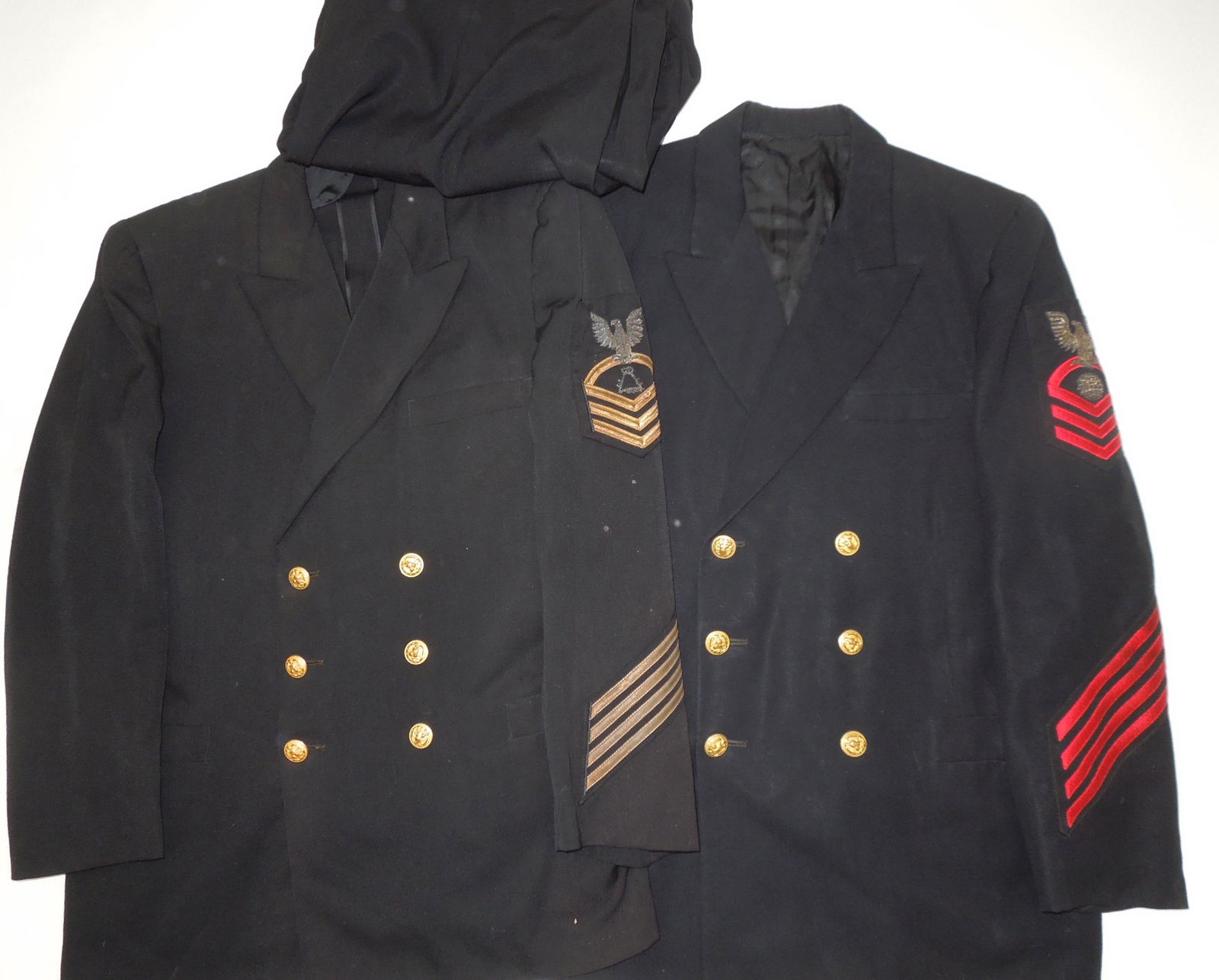 WWII USN Navy CPO Chief Petty Officer Uniforms Jackets Bullion Patches Lot of 2: Lot of 2 unnamed WWII - 50's era Chief Petty Officer USN Jackets and one pair of pants. Nice bullion rates. Good condition though one jacket has some spotting on the left sleeve.