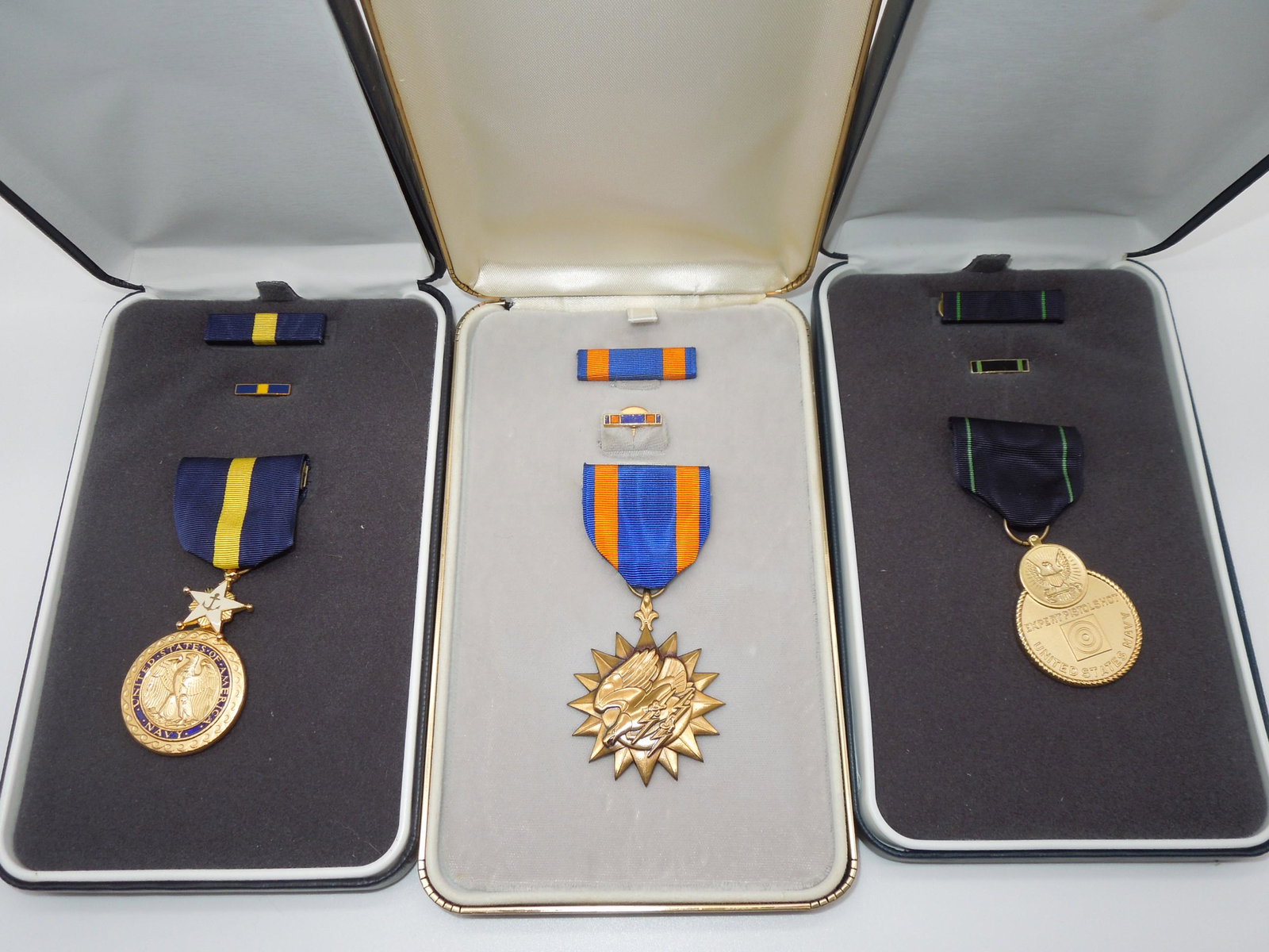 Navy Distinguished Service Cross DSC, Air Medal & Expert Pistol Shot Lot of 3: Navy Distinguished Service Medal (DSM), Air Medal & Expert Pistol Shot Medal Lot of 3. You will receive the following boxed medals: Navy Distinguished Service Cross with ribbon bar and lapel pin, Air 