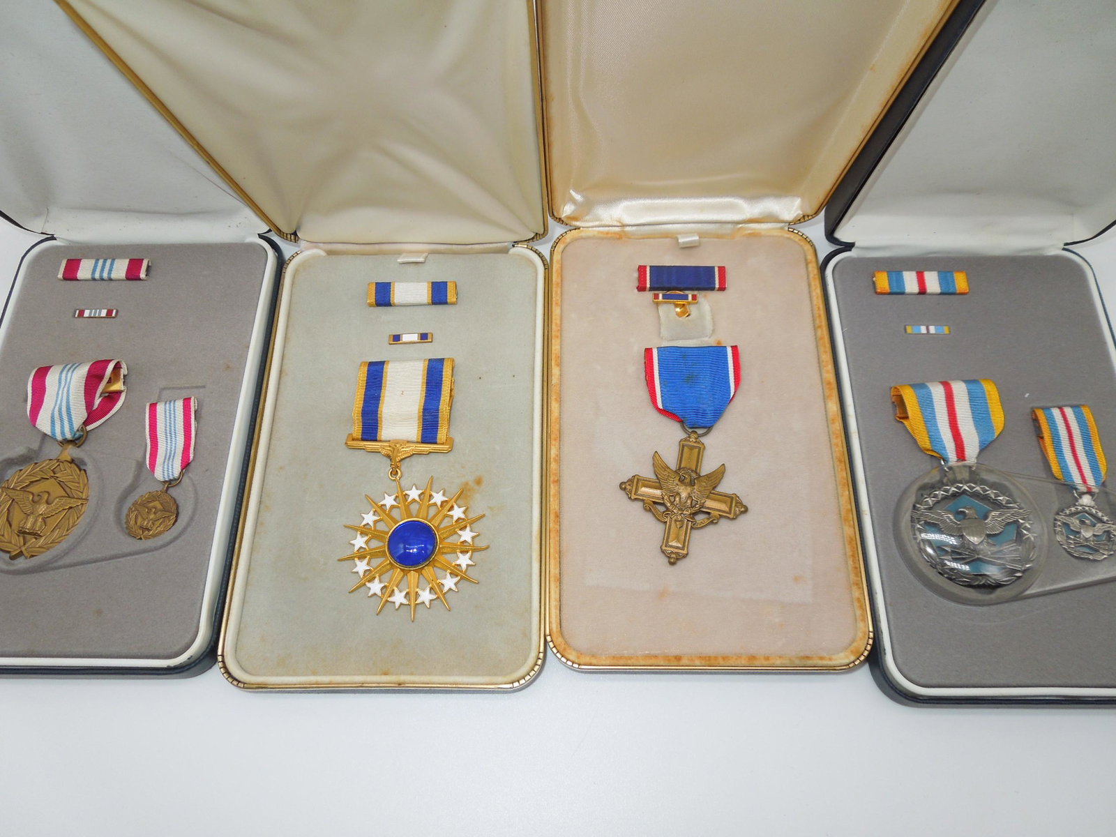 Military Medals DSC USAF DSM Distinguished Service Lot of 4: Lot of four medals in their cases as shown. Good condition with some wear to the cases.