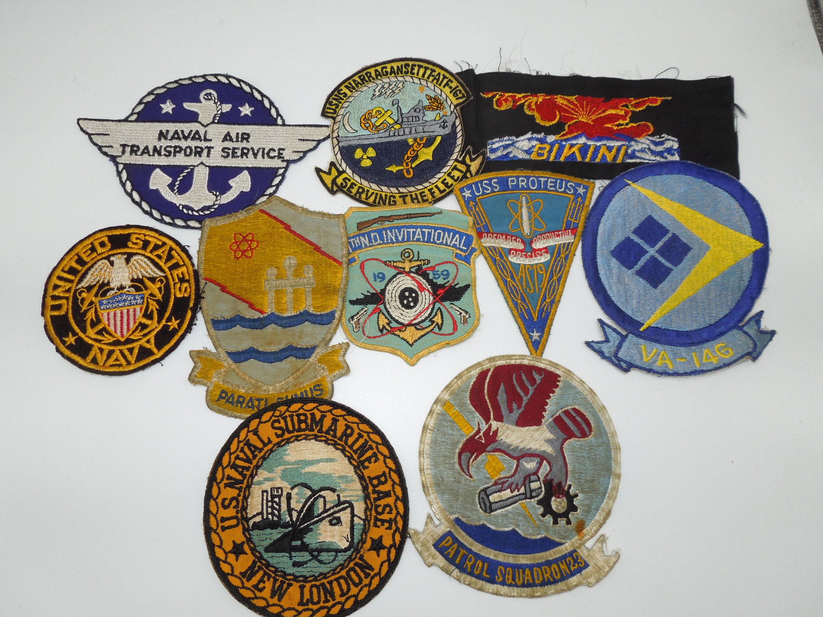 USN Navy Theater Made Patches Bikini Atoll Lot of 10: Lot of US Navy patches- Naval Air Transport Service, USNS Narragansett-ATF-167, Bikini Atoll testing, USS Proteus, VA-146, Patrol Squadron 23, US Naval Submarine Base New London, 1959 US Navy rifle in