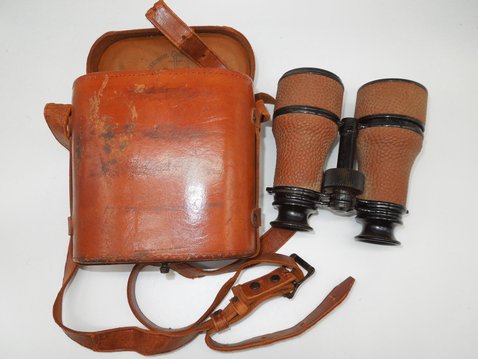 WWII USN Navy Binoculars in Case Naval Gun Factory: WWII USN Navy Naval Gun Factory binoculars (3 Power) in brown leather case with the same logo, and handwriting on the front. Annex Optical Shop Rochester, N.Y. The leather strap is supple and does not