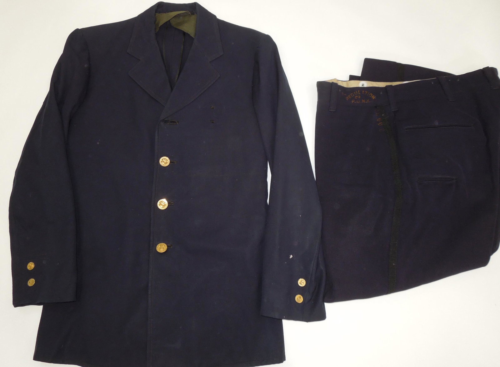 1939 Binghamton, New York & NYPD Police Officer Named Uniform Jacket & Pants: 1939 named Binghamton, New York Police jacket named and dated on the tailor label. The top button is missing, and there are some holes, most notable on the lower left sleeve. The pants are NYPD 14th P
