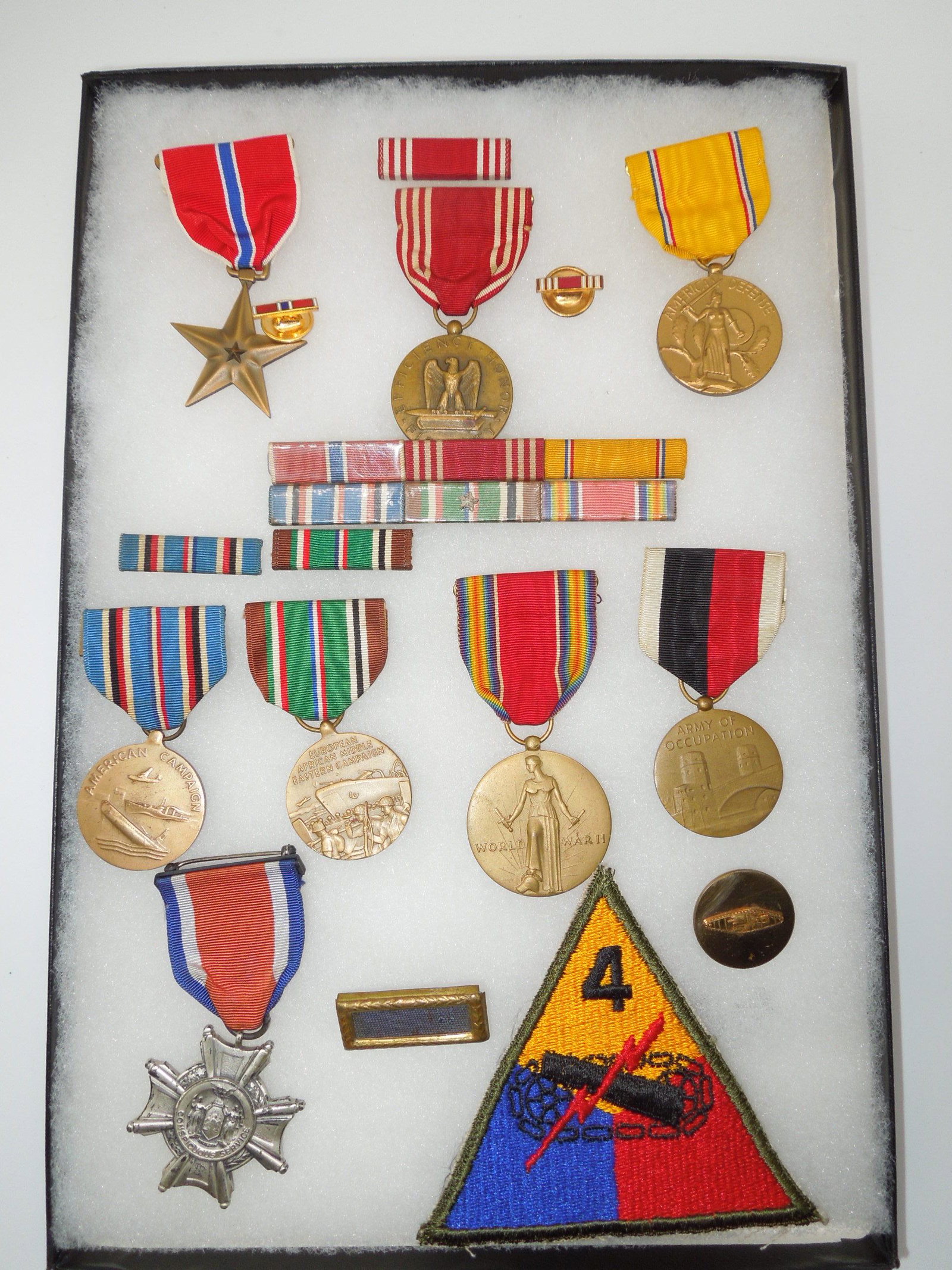 Named WWII US 4th Armored Division CSC Bronze Star Medal Group & Research: WWII 4th Armored Division Group to Master Sergeant William S. VanHouten of Rockville Center, New York. The Conspicuous Service Cross is an early sterling numbered example that traces to him. Comes wit