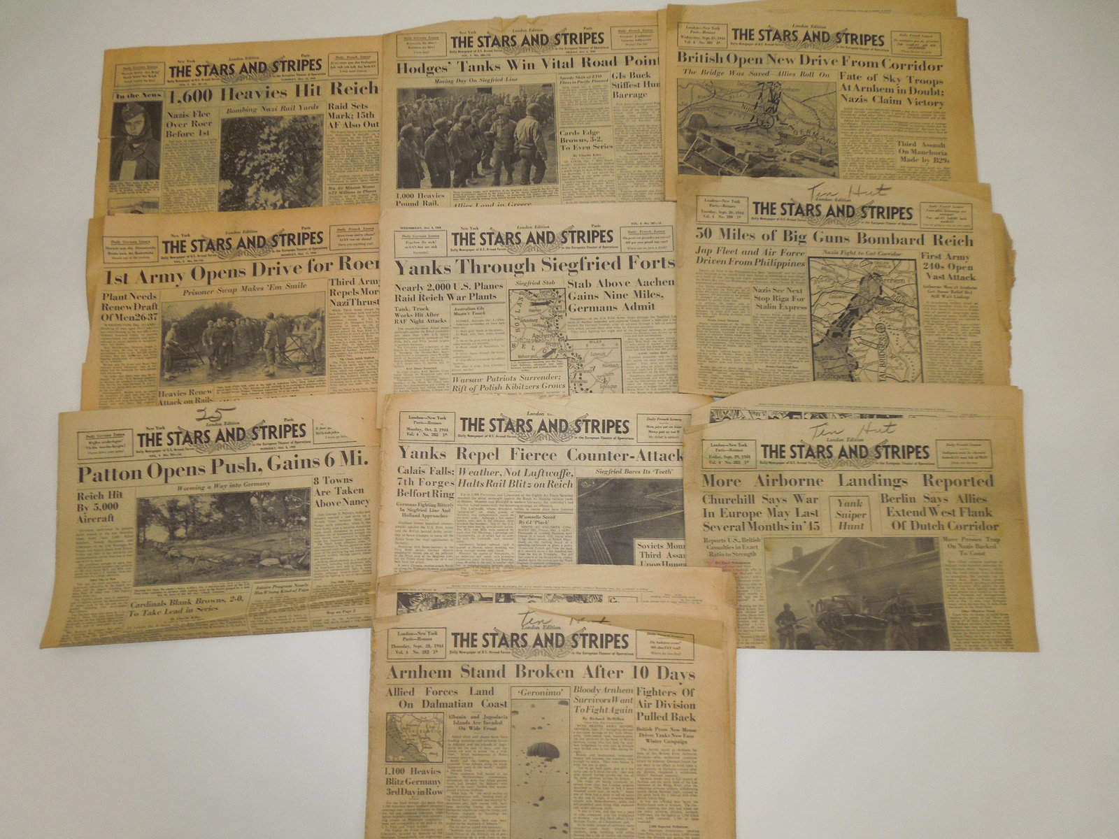 WWII US Military Stars & Stripes Newspapers: Ten vintage WWII Stars and Stripes Newspapers with important articles, photos, and news. Condition is fair with the old paper flaking in some areas and the edges showing wear from age.
