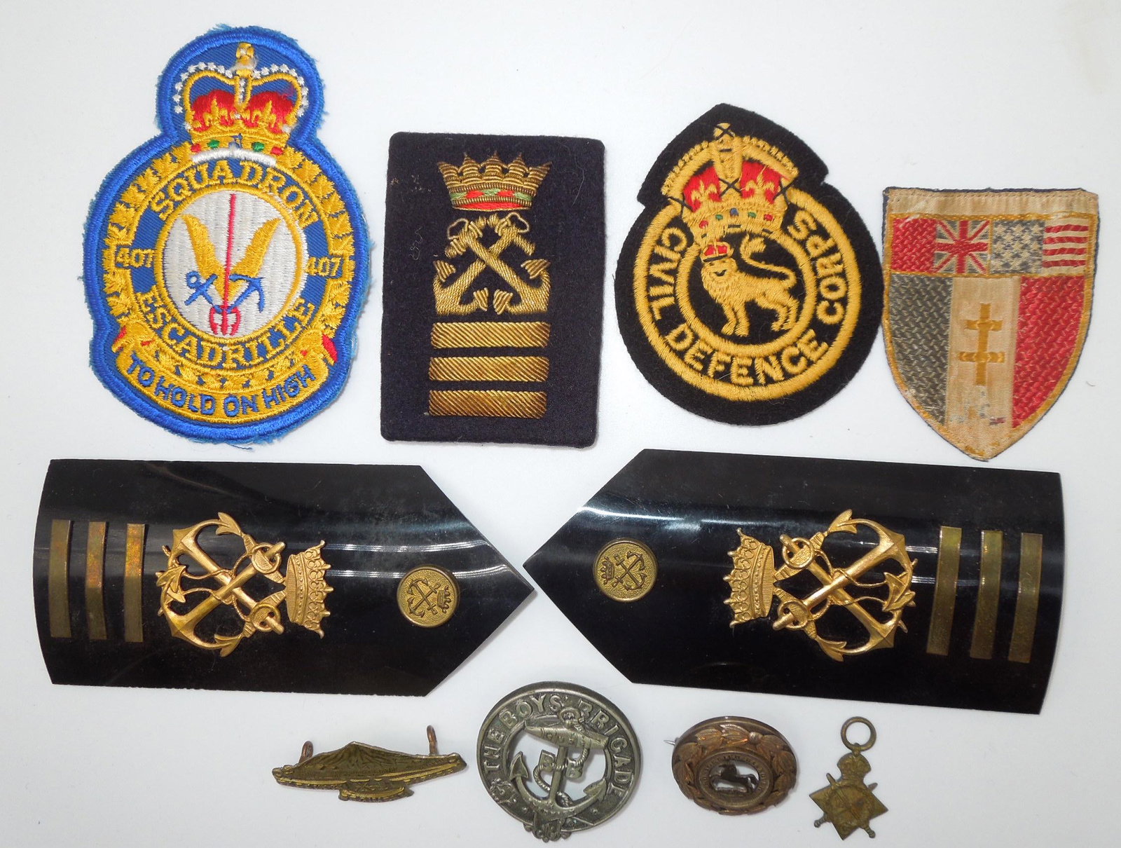 British & European Patches Badges Pins Lot WWII - 1970s: Lot of misc. Foreign European type rank boards, pins, badges, etc. Good condition showing signs of age and use.