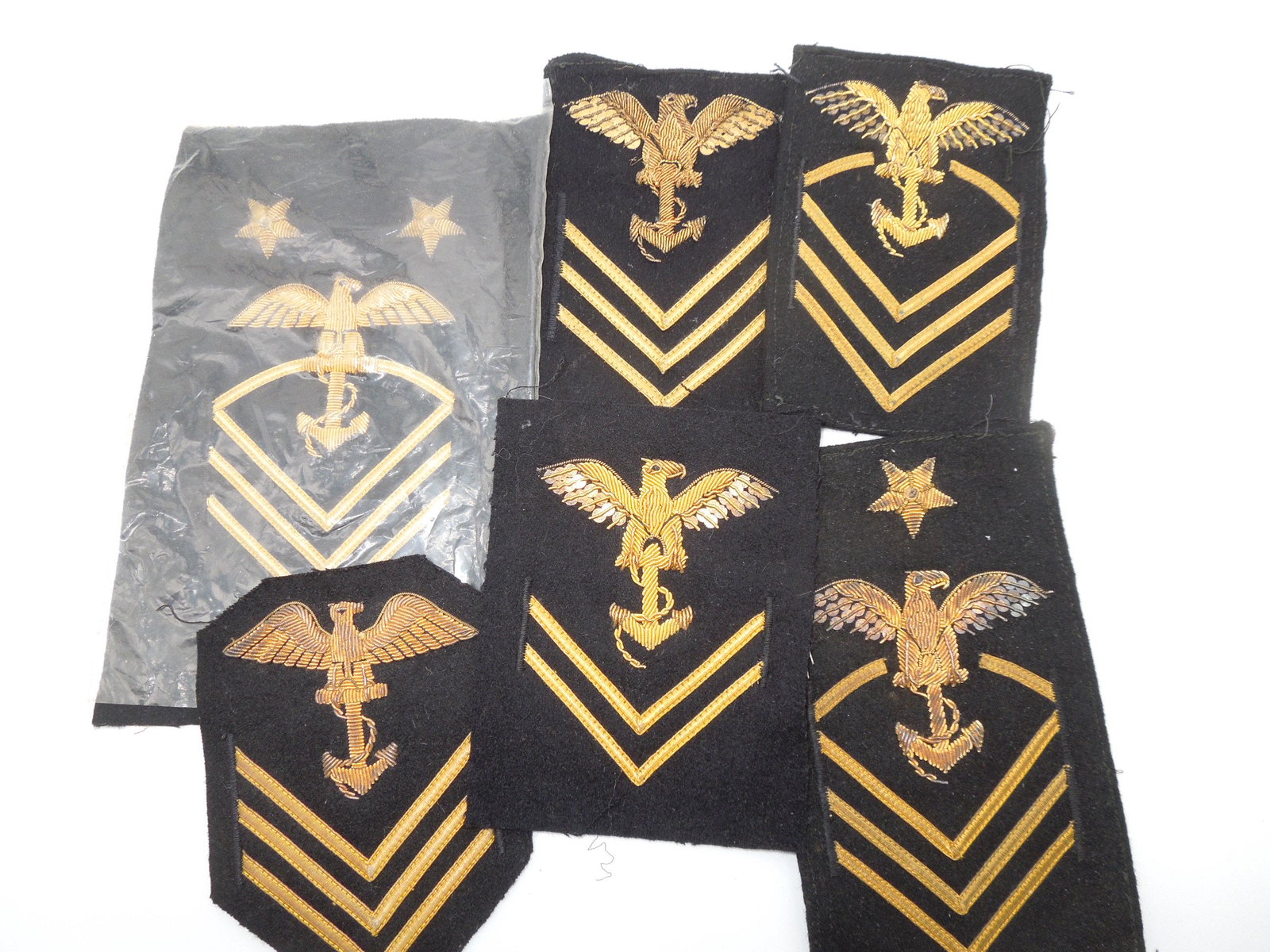 Vintage USN Navy Midshipman Bullion Rating Patches Lot of 6: Lot of six WWII or later vintage patches for midshipman uniforms. All made of bullion and one being in the original cellophane wrap. Good condition with wear and loose strings from age.