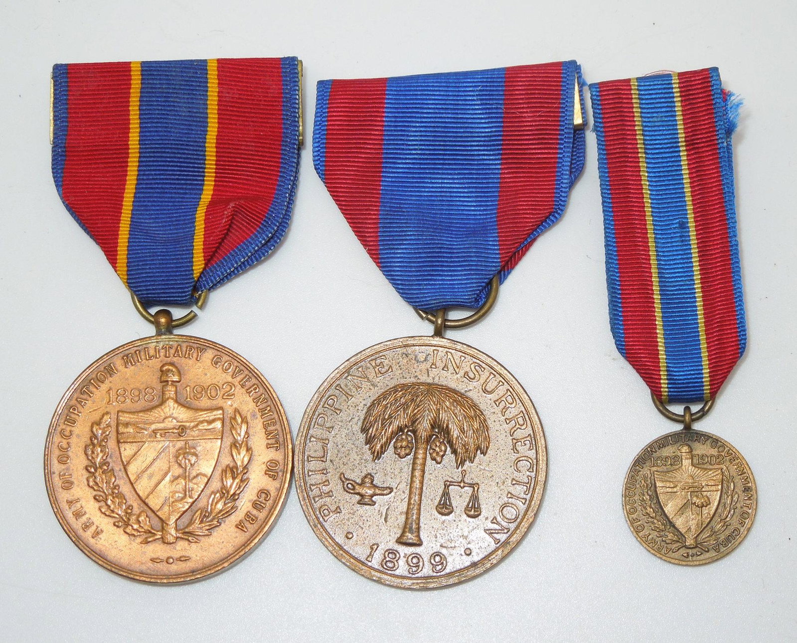 Modern Philippine Insurrection (#29269) & Cuban Occupation Medals: Lot of 70s to modern made medals, one is numbered on the planchet. Good condition.