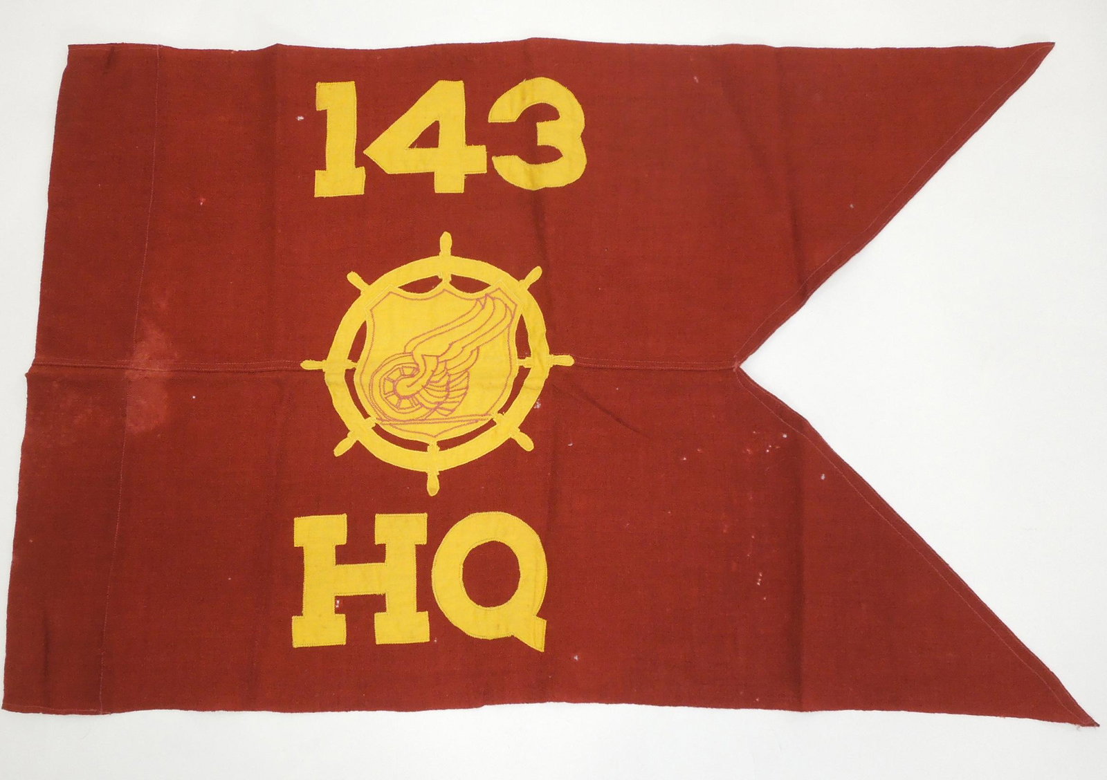WWII 143rd Transportation Guidon Flag Quartermaster Issued: Original Quartermaster tagged WWII 143rd Transportation Guidon Flag. Used condition with some staining and fading.