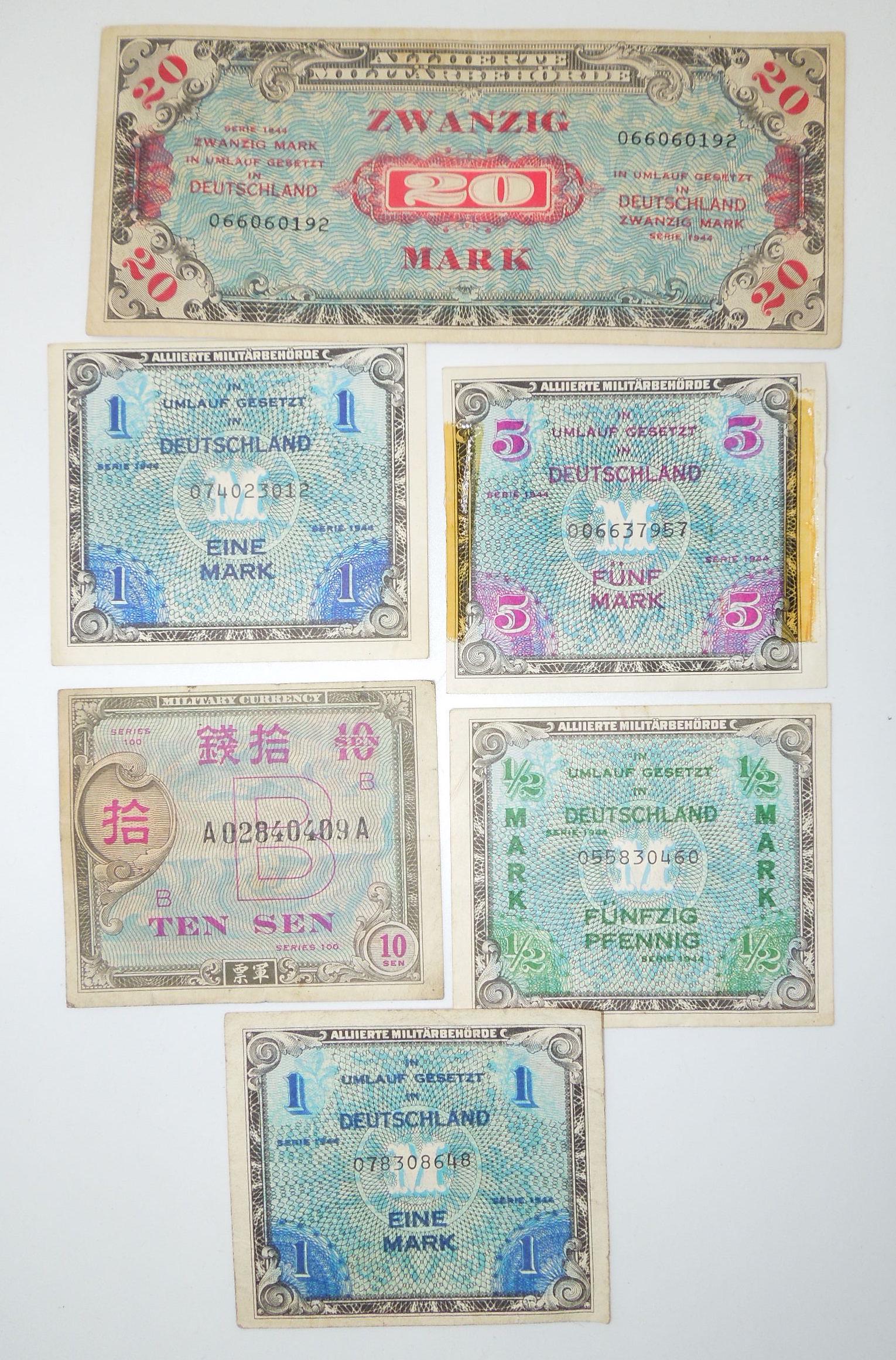 WWII German & Japanese Military Currency Money: Lot of original period WWII era money as shown. All pieces show use and age consistent with old money.