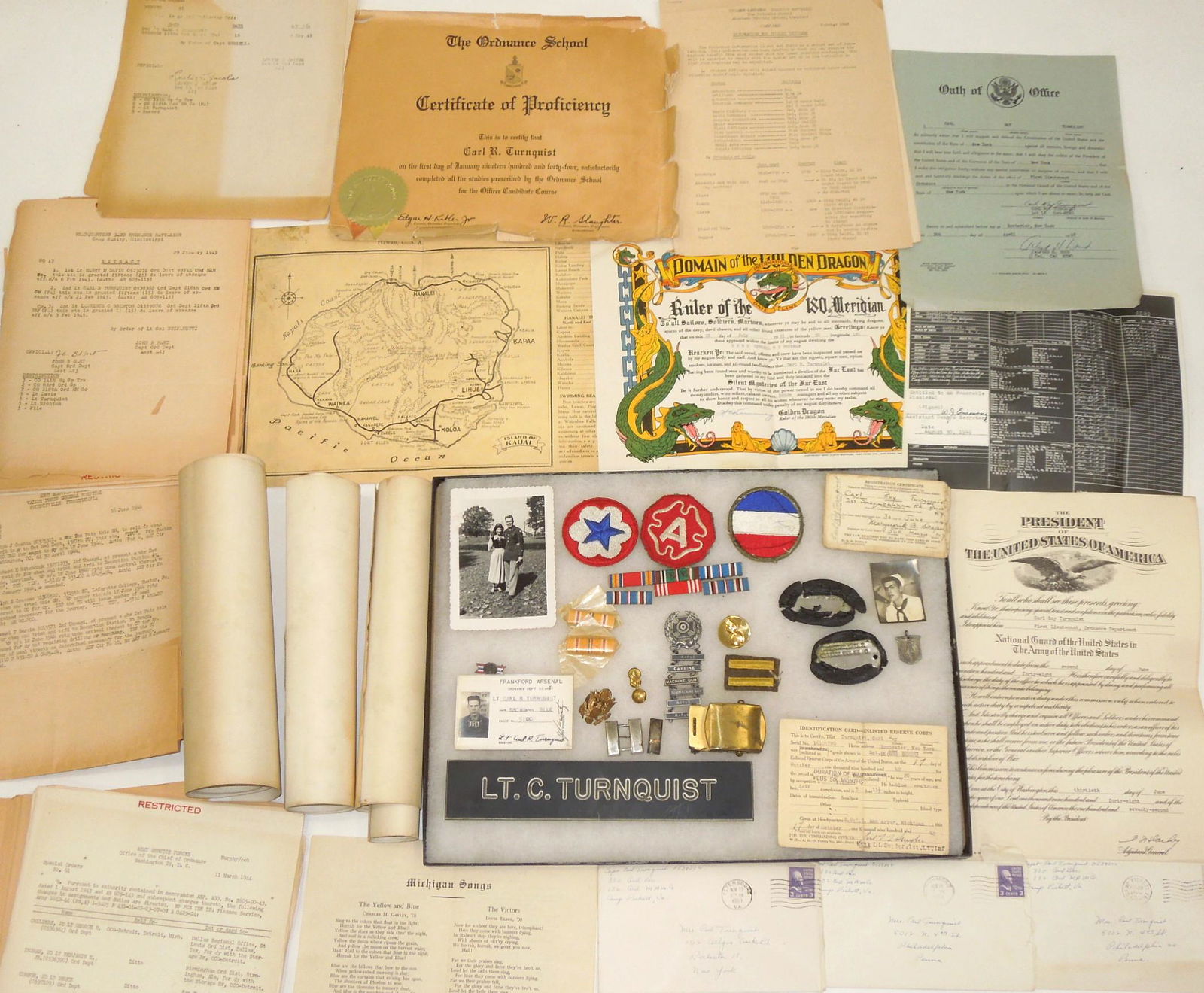 WWII Ninth Army Ordnance Corps Officer European Theater Dog Tag Ribbons Paper Archive: WWII Ninth Army Officer European Theater Dog Tag Ribbons Paper Archive. Named to Ordnance Corps Captain Carl Roy Turnquist. Turnquist enlisted on 31 Dec 1943 and was discharged on 28 Sep 1946. He re-e