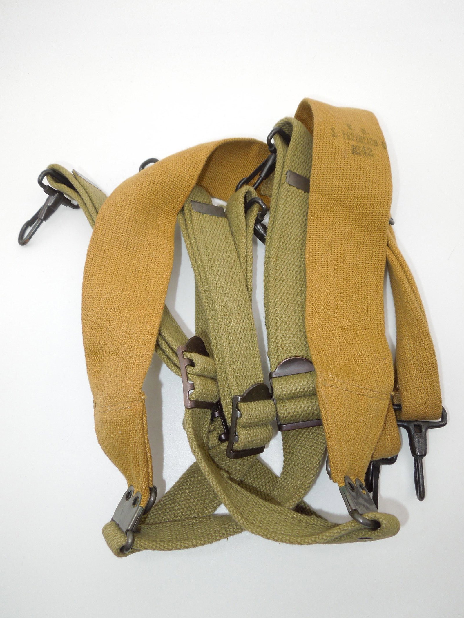 WWII 1942 US Army M1936 FROEHLICH Combat Suspenders Field Gear: WWII Army M-1936 Suspenders Field Gear. WWII US webbing suspenders, with adjustable straps and hooks. These were used to support the pistol or cartridge belts, and for carrying the M-1936 canvas field