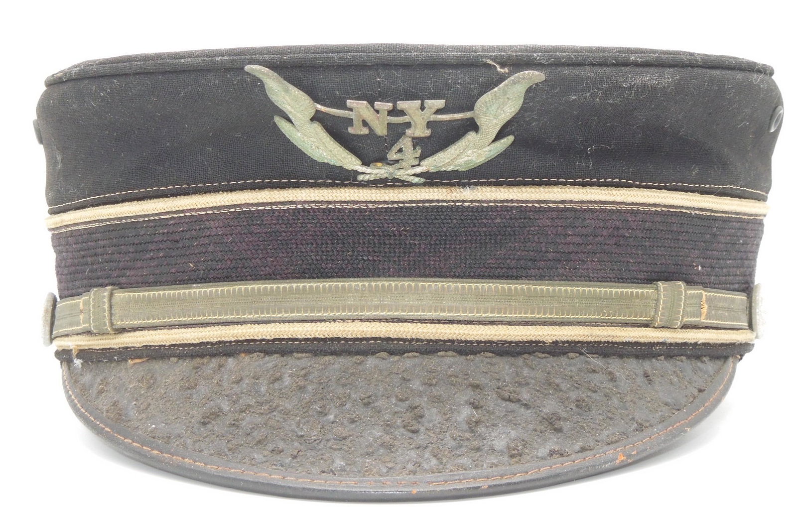 New York 1800s Militia 4th Regiment Officer Visor Cap: Late 1800s to early 1900s cap for the NY 4th as shown. Unknown what speciifc unit it represents or what the buttons signify. The cap is in fair condition with crazing to the visor and 100+ year old we