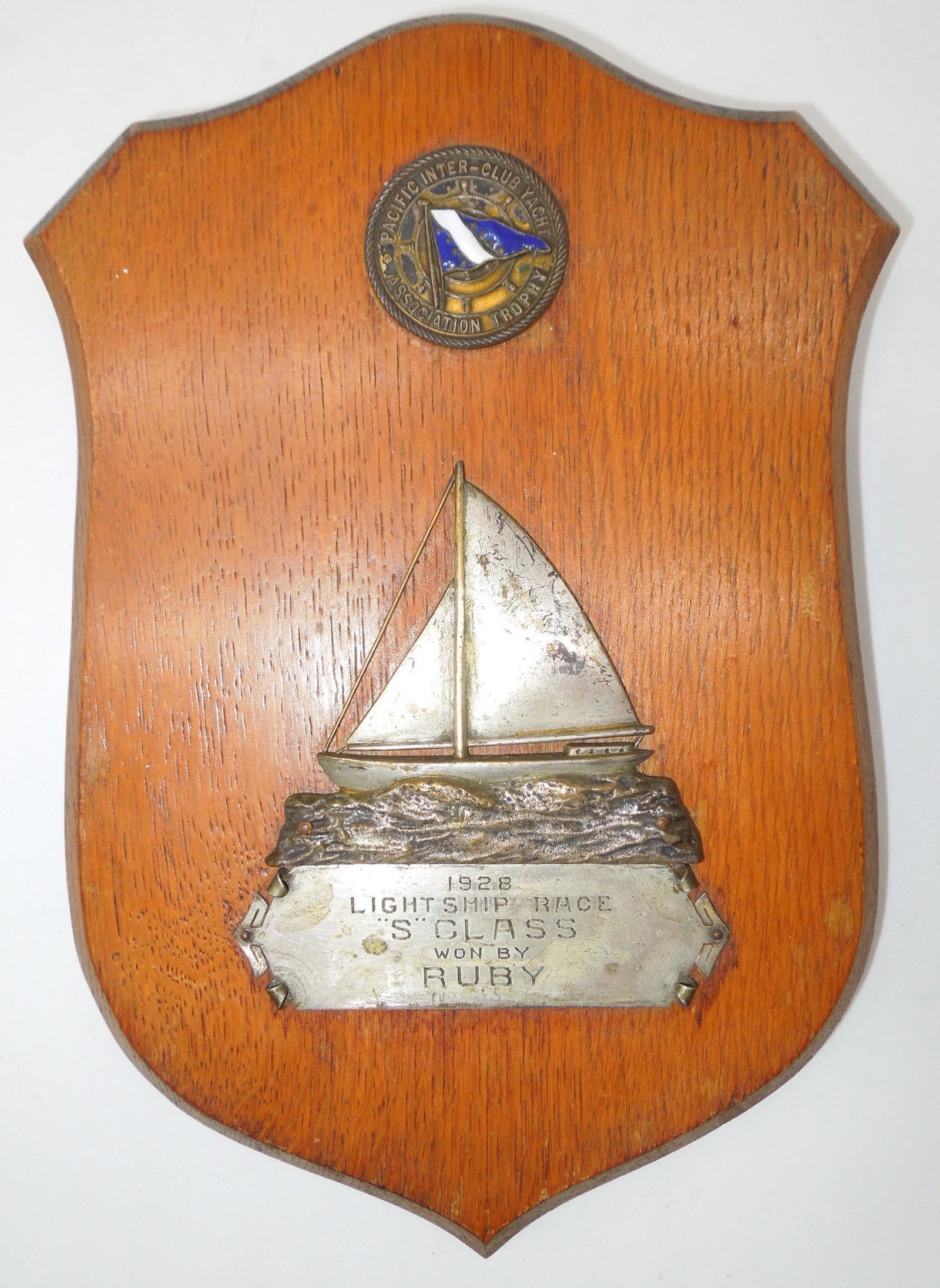 1928 Pacific Inter Club Yacht Association Lightship Race Winners Wooden Plaque: 1928 Lightship Race Pacific Yacht Wooded Plaque. S Class Won By Ruby. Presented by: Pacific Inter-Club Yacht Association Trophy. The Approximate Size is 9 x 6.25 inches.