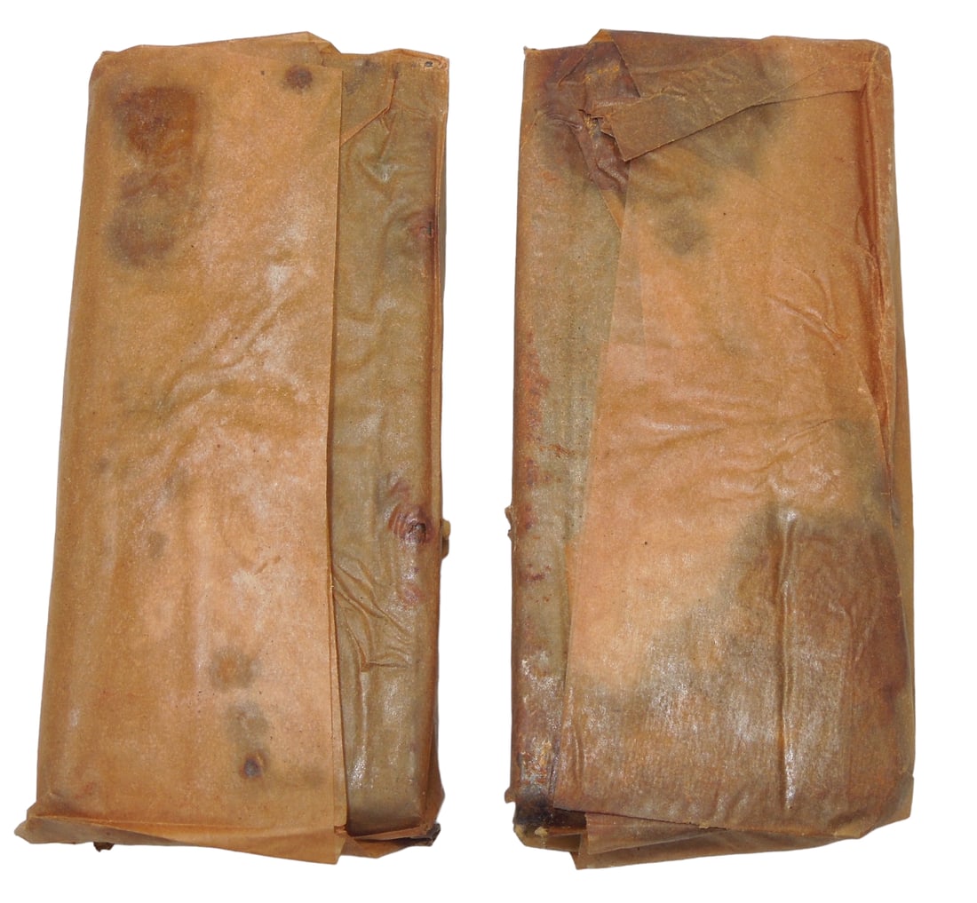 WWII US Army M-1 Carbine Wrapped Magazines: Two original unissued, WWII era M-1 Carbine magazines. They have been stored poorly, so there is rusting.