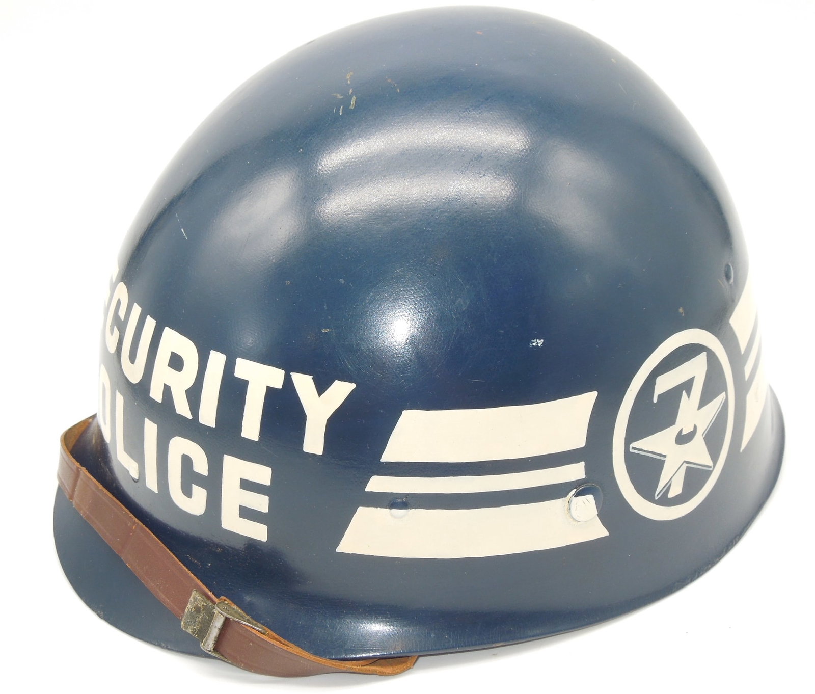 Vietnam US 7th Air Force 632nd Security Police Painted M-1 Helmet Liner: 1963 dated Firestone liner, painted for the 632nd Security Police, Vietnam Era in the 7th Air Force. With leather chinstrap.