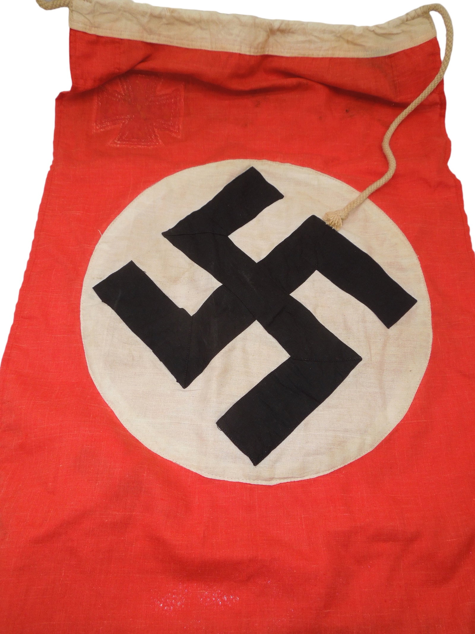 WWII German Naval Flag Ensign Dated 1944: Small German naval flag measuring 46 x 86 centimeters, stamped 1944. It looks like the Cross on both sides was removed. The swastika center on both sides is multi-piece construction. Good condition.