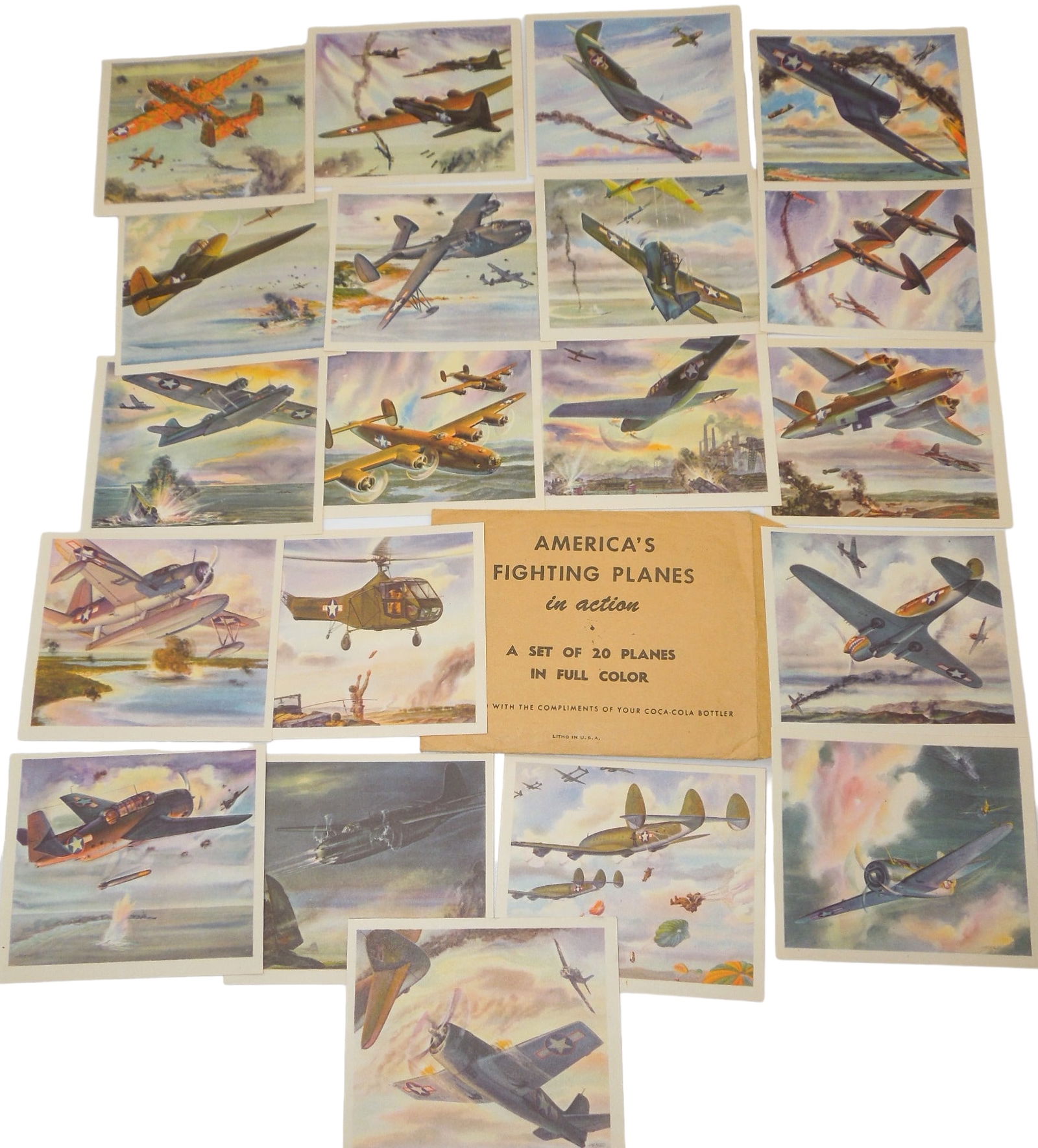 WWII Era 1943 Coca-Cola American Fighting Planes in Action Color Aircraft Cards Set: 1943 Coca-Cola Americas Fighting Planes in action card set 1-20. Includes original envelope. Presented With The Compliments of Your Coca-Cola Bottler. Approximate size is 3.5 x 3 inches. Cards are in