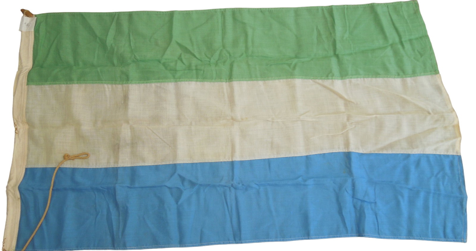 Circa 1970 National Flag of Sierra Leone: Original flag measuring 30 x 52 inches sent from Sierra Leone to Dr. Clarence Rungee for his International flag museum. Good condition. Made in London.