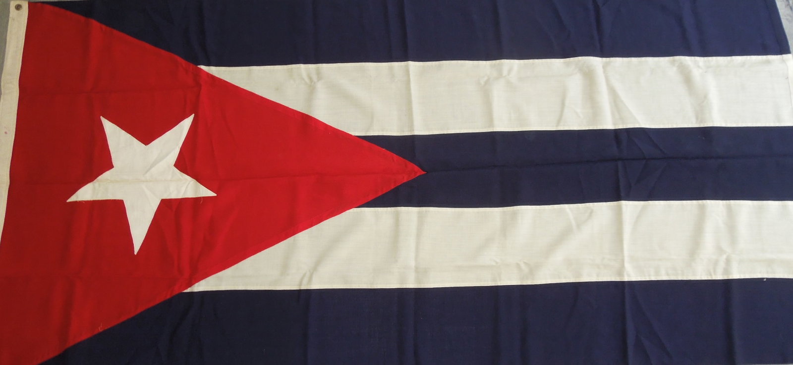 1948 Large National Flag of Cuba: Original flag measuring 3 feet 10 inches by 7 feet 7 inches sent from Cuba to Dr. Clarence Rungee for his International flag museum. Good condition. Comes with two letters and an inventory sheet.