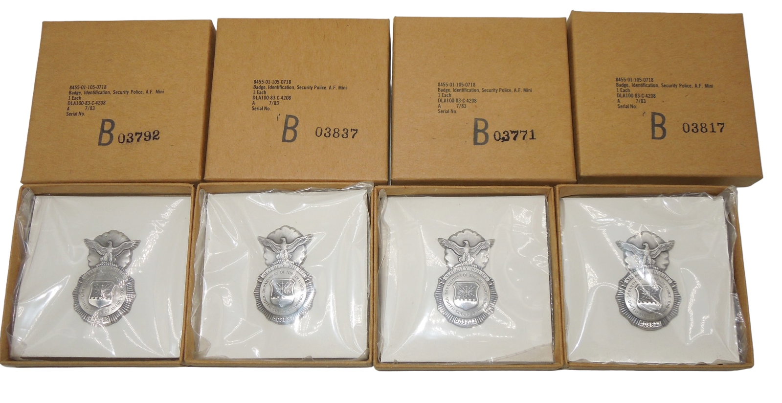 1980s Lot (4) USAF Air Force Security Police Numbered Badges & Boxes: Lot of four original unissued mini Security Police USAF badges, numbered, in corresponding matching boxes. Excellent condition.