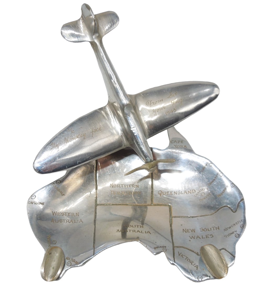 WWII 1943 Engraved Display Vought F4U Corsair Plane & Australia Ashtray: WWII 1943 Engraved Display Vought F4U Corsair Plane & Australia Ashtray. Engraved on the Aircraft: â€œTo My Monkey Face From Ed Your Lug 1943”. The ashtray itself shows areas of Australia. N